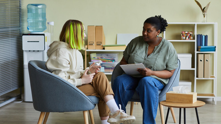 Two women talking - adult social care