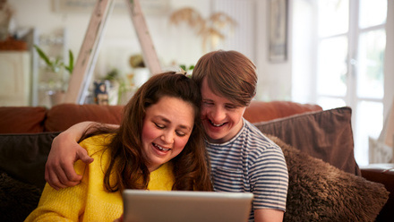 Disabled couple looking at laptop screen.jpg