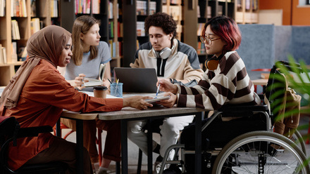 Group of young people, one in a wheelchair, in library.jpg