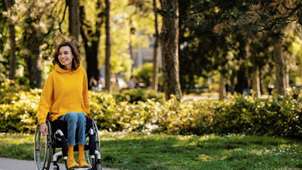 Brightly dressed woman in wheelchair outdoors - lo-res.jpg