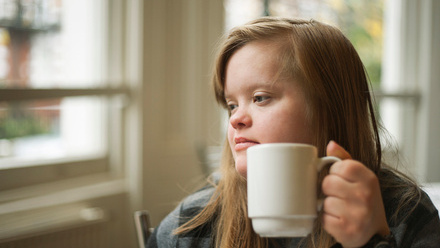 Disabled woman drinking tea