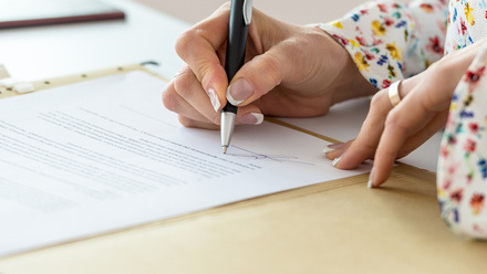 contract woman signing