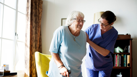 Elderly woman at home with nurse.jpg