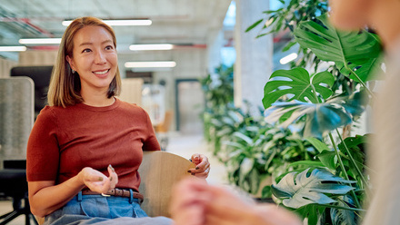 woman in the workplace with plants mental health