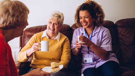 Two women in home setting with care worker.jpg